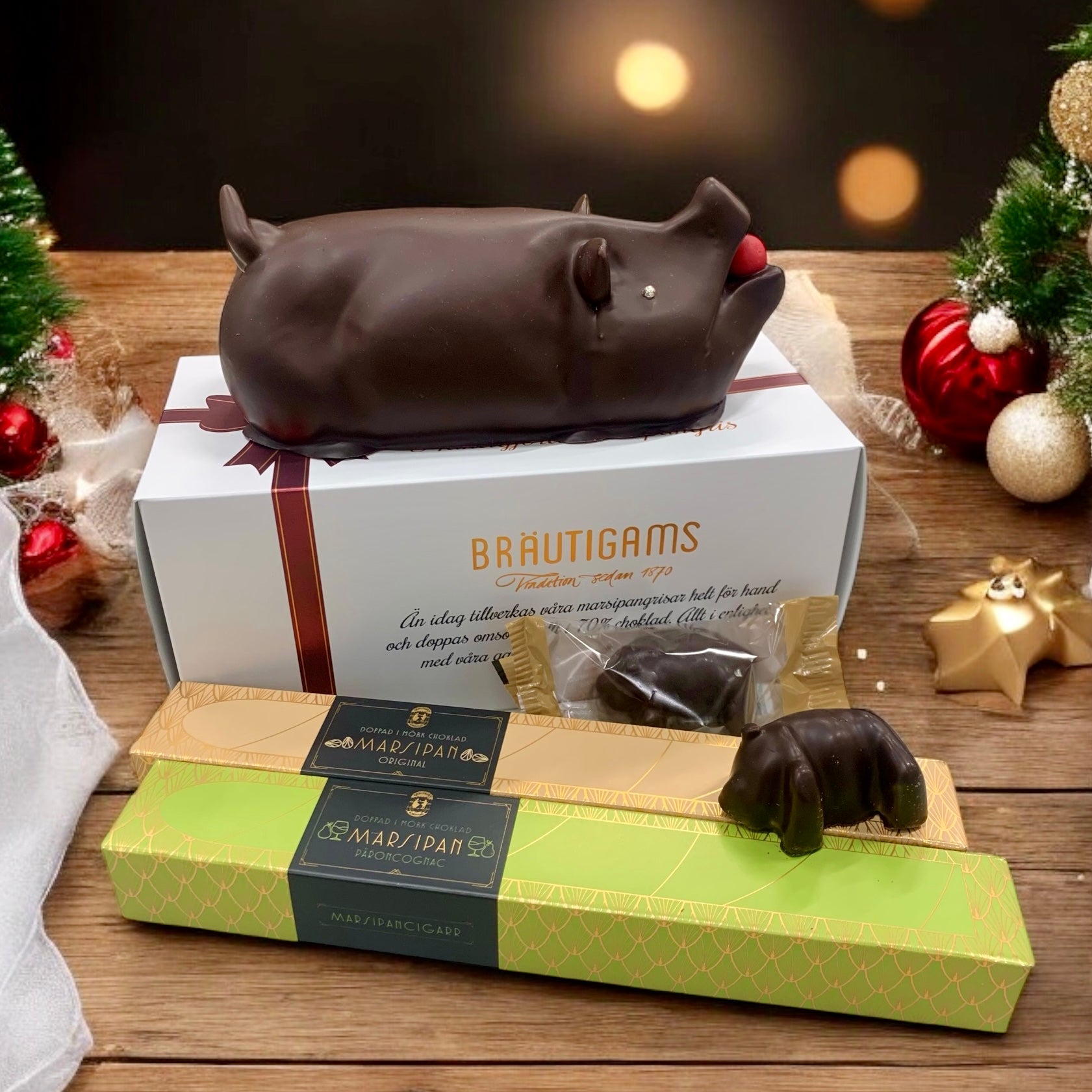 Stor julkasse från Bräutigams med julgodis och kakor, visa förpackning med festlig design och juldekorationer.